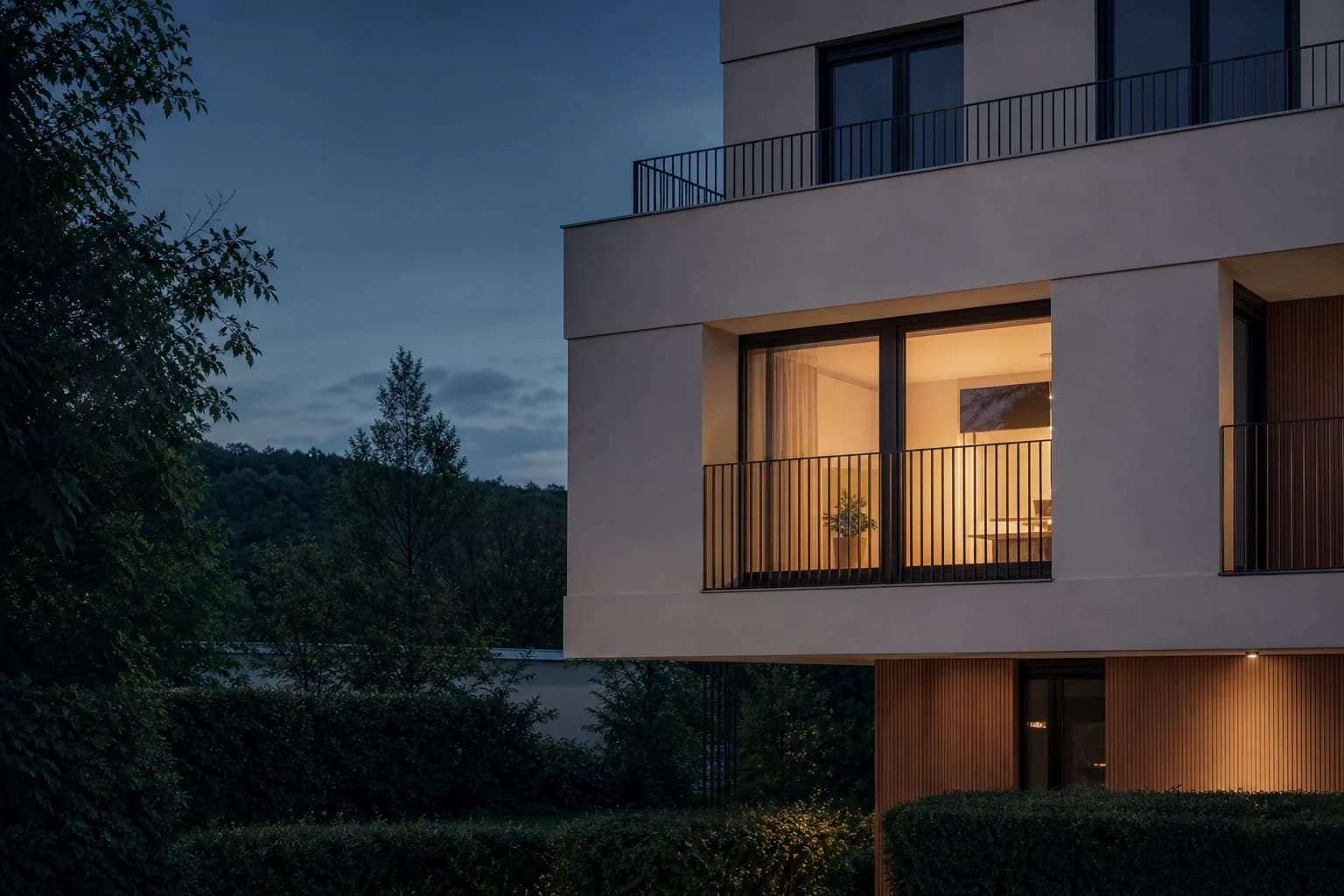 Contemporary residential architecture at blue hour with a warmly lit home